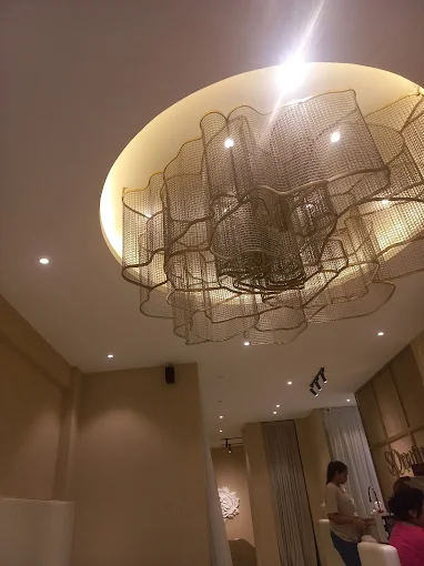 SOHO Salon — gold chandelier ceiling